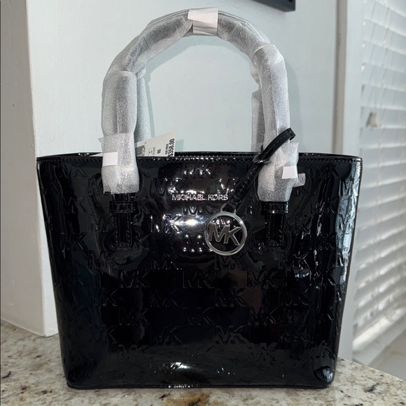 Michael Kors Handbags - Michael Kors Jet Set XS Black Patent Logo Debossed Convertible Tote BEAUTIFUL
